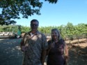 Brian and Diane sip in the vineyard